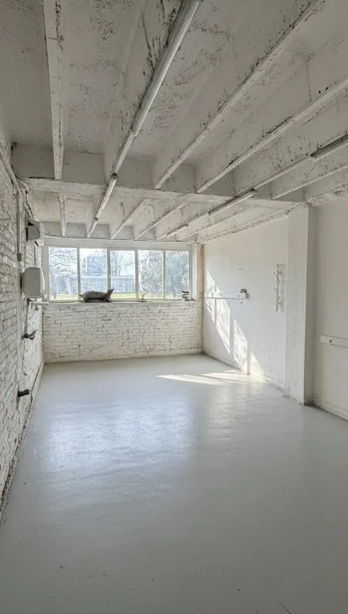 White room with a large window